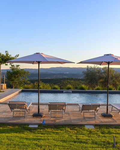 Podere Vigna Nuova: Sky, Tree, Swimming Pool, Outdoor Furniture, Sunlounger, Resort, Umbrella, Eco Hotel, Landscaping, Resort Town