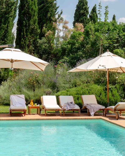 Podere i Poggi: Swimming Pool, Outdoor Furniture, Umbrella, Resort, Furniture, Sunlounger, Shade, Garden, Eco Hotel, Landscaping