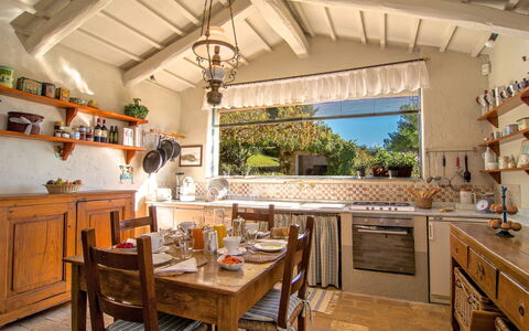 Villa Sagrantino: Furniture, Kitchen, Interior Design, Wood, Countertop, Home, Cabinetry, Table, Chair, Room