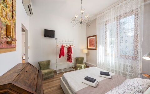 Casamia Sky-High Panoramic Retreat: Penthouse with: Interior Design, Furniture, Flooring, Floor, Bedroom, Textile, Room, Ceiling, Bed, Lighting