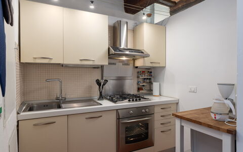 The Silent Courtyard Retreat: Spacious 2-Bedroom S: Kitchen Appliance, Kitchen, Countertop, Major Appliance, Cabinetry, Kitchen Stove, Stove, Home Appliance, Interior Design, Kitchen Sink