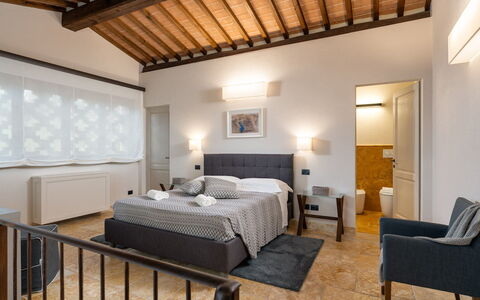 Villa Cortona: Eco-Sustainable Luxury Estate with: Furniture, Interior Design, Bed, Bedroom, Ceiling, Bedding, Floor, Lighting, Room, Bed Sheet