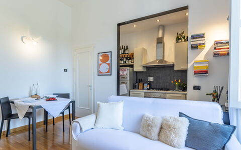 Green Suite Florence: Furniture, Interior Design, Flooring, Room, Floor, Couch, Wood, Ceiling, Table, Living Room