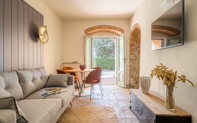 Relais Badia a Passignano - Appartamento Nebbiolo: Furniture, Wall, Interior Design, Flooring, Couch, Floor, Lighting, Living Room, Table, Room