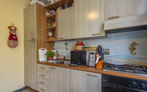 Attico Marino: Wood, Kitchen Appliance, Kitchen, Major Appliance, Interior Design, Countertop, Cabinetry, Flooring, Room, Furniture