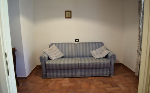 Oasi Della Pergola: Furniture, Couch, Interior Design, Flooring, Floor, Wood, Room, Living Room, Apartment