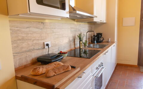 Marina's Lodge: Countertop, Kitchen, Furniture, Wood, Flooring, Kitchen Appliance, Cabinetry, Food, Kitchen Sink, Interior Design