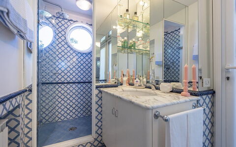 La Terrazza sul Mare: Blue, Wall, Interior Design, Plumbing Fixture, Bathroom, Flooring, Lighting, Mirror, Floor, Tile