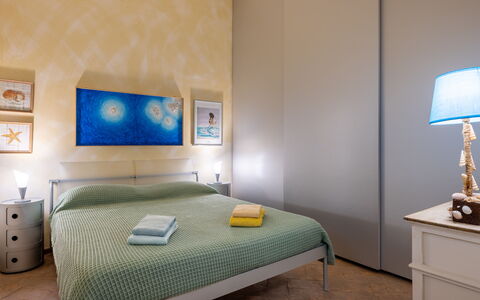 Stella Marina Apartment with Pool, Porto Santo Ste: Furniture, Bed, Interior Design, Bedroom, Floor, Wall, Flooring, Bed Sheet, Bedding, Room