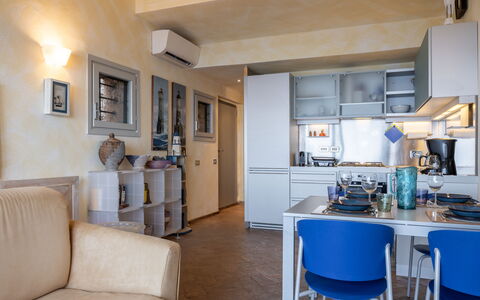 Stella Marina Apartment with Pool, Porto Santo Ste: Furniture, Interior Design, Flooring, Room, Floor, Apartment, Ceiling, Table, Lighting, Chair