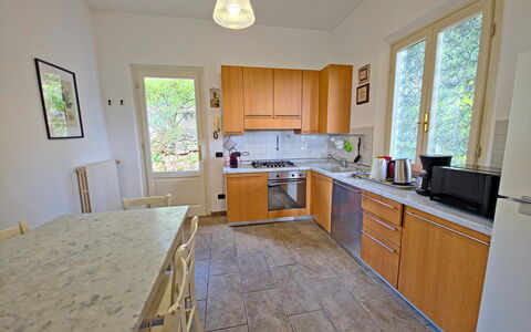 Villa Il Giardino: Flooring, Countertop, Kitchen, Wood, Floor, Interior Design, Furniture, Kitchen Appliance, Major Appliance, Cabinetry