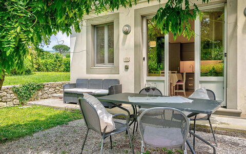 Villa Church: Shrub, Garden, Outdoor Furniture, Backyard, Shade, Chair, Outdoor Table, Yard, Landscaping, Lawn