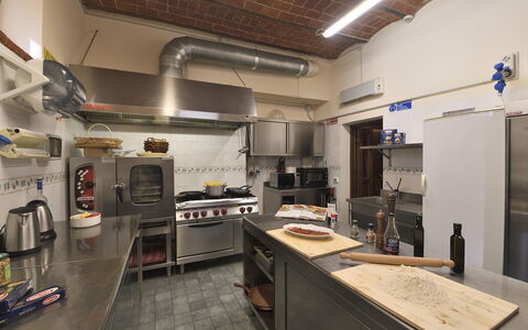 Villa Michelangelo: Kitchen, Countertop, Furniture, Kitchen Appliance, Major Appliance, Lighting, Interior Design, Flooring, Ceiling, Kitchen Stove