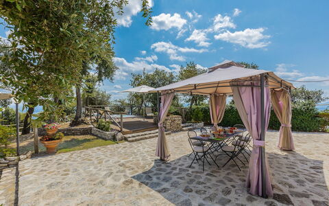 Villa Bastiano: Flagstone, Shade, Outdoor Structure, Garden, Flowerpot, Chair, Gazebo, Outdoor Furniture, Landscaping, Patio