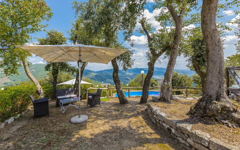 Villa Bastiano: Blue, Tree, Landscape, Sunlight, Mountain Range, Hill Station, Shade, Valley, Ridge, Landscaping