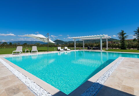 Villa Monsummano: Blue, Swimming Pool, Water, Resort, Composite Material, Eco Hotel, Leisure, Outdoor Furniture, Shade, Landscaping