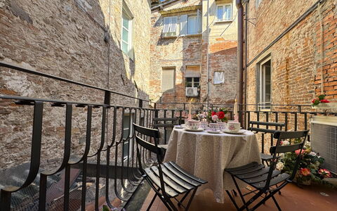 Casa Elena 13: Flowerpot, Brick, Houseplant, Balcony, Chair, Brickwork, Handrail, Outdoor Table, Baluster, Outdoor Furniture