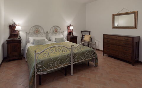 Villa Essiccatoio: Furniture, Bed, Interior Design, Bedroom, Flooring, Floor, Wood, Ceiling, Bedding, Room