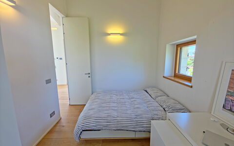 Villa Elena: Interior Design, Wall, Bedroom, Flooring, Wood, Bed, Floor, Ceiling, Room, Lighting