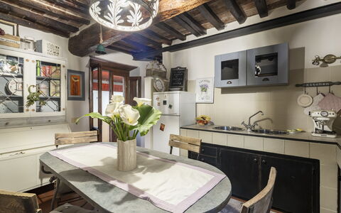La Casa del Grillo Parlante: Furniture, Interior Design, Flooring, Wood, Kitchen, Floor, Countertop, Chair, Ceiling, Table