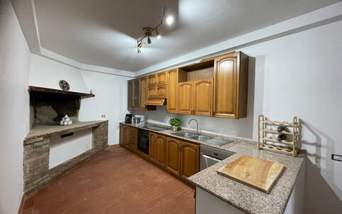 Villa i Fiori: Kitchen, Countertop, Flooring, Interior Design, Ceiling, Wood, Cabinetry, Floor, Kitchen Appliance, Major Appliance