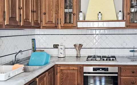 Casa Lulù: Kitchen, Countertop, Kitchen Appliance, Cabinetry, Major Appliance, Kitchen Sink, Wood, Kitchen Stove, Interior Design, Flooring