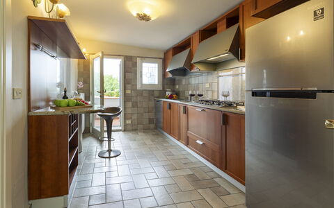 Villa Ninfeo 10+4: Kitchen, Countertop, Major Appliance, Kitchen Appliance, Furniture, Flooring, Interior Design, Cabinetry, Ceiling, Home Appliance