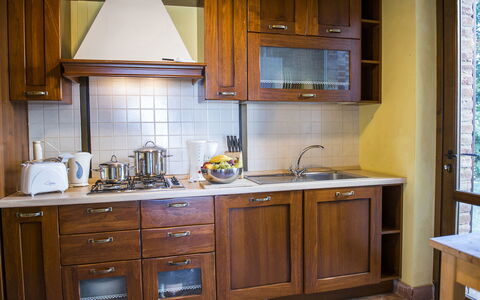 La Torre dei Fagiani 8+2: Kitchen, Cabinetry, Kitchen Appliance, Major Appliance, Wood, Countertop, Interior Design, Cupboard, Furniture, Flooring