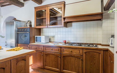 Villalta 18+2: Kitchen, Cabinetry, Wood, Interior Design, Countertop, Kitchen Appliance, Furniture, Flooring, Major Appliance, Cupboard