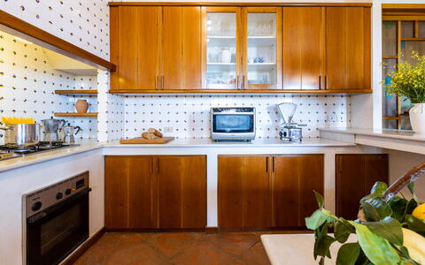 Villa Desiderio 9: Kitchen, Countertop, Kitchen Appliance, Cabinetry, Interior Design, Major Appliance, Flooring, Wood, Furniture, Lighting