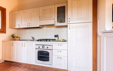 Casale Teatro 10: Wood, Kitchen, Cabinetry, Flooring, Major Appliance, Interior Design, Kitchen Appliance, Countertop, Cupboard, Floor