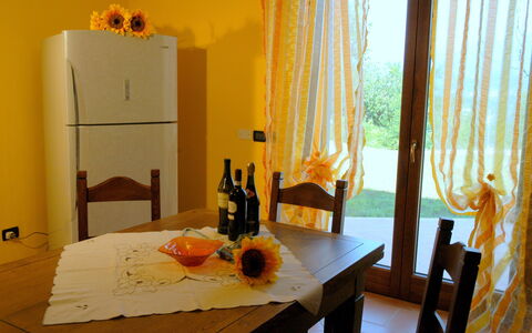 Villa Saida: Room, Dining Room, Orange, Furniture, Table, Yellow, Interior Design, Property, Curtain, Home