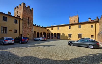 Certaldo: Town, Blue, Property, Building, Vehicle, Car, Luxury Vehicle, Wall, Architecture, Human Settlement