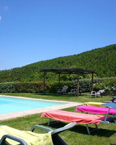Torre di Vignale: Sky, Water, Plant, Natural Landscape, Swimming Pool, Outdoor Furniture, Vegetation, Body Of Water, Shade, Grass