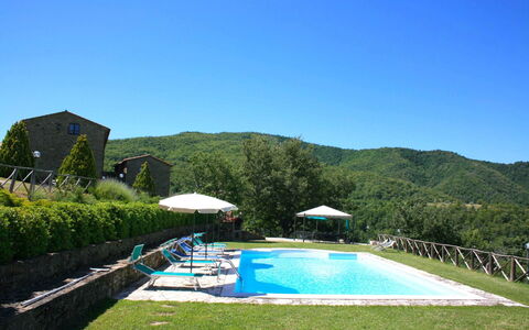 Borgo Antico: Water, Sky, Plant, Property, Azure, Natural Landscape, Swimming Pool, Tree, Mountain, Grass