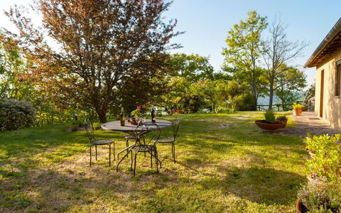 Casa la Primula: Plant, Sky, Table, Window, Tree, Shade, Natural Landscape, Land Lot, Sunlight, Building