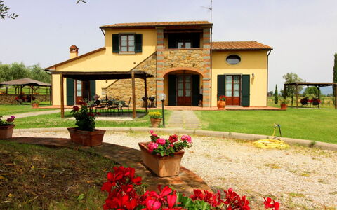 Podere Marcigliano: Flower, Plant, Sky, Building, Window, Tree, House, Land Lot, Door, Grass