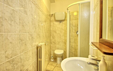 Villa Lorenzo: Bathroom, Property, Room, Tile, Interior Design, Wall, Yellow, Architecture, Floor, House