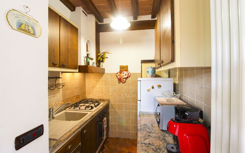 La Casetta nel Bosco: Kitchen, Countertop, Interior Design, Major Appliance, Kitchen Appliance, Wood, Flooring, Ceiling, Floor, Furniture