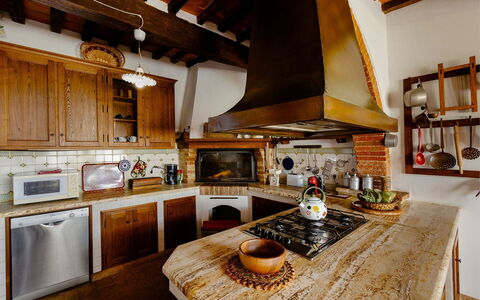 Villa Scianellone: Countertop, Cabinetry, Property, Furniture, Kitchen, Kitchen Appliance, Kitchen Stove, Wood, Lighting, Interior Design