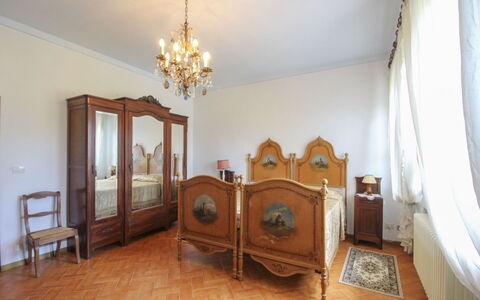 Villa Quattro Mori: Furniture, Interior Design, Bedroom, Flooring, Bed, Floor, Wood, Room, Lighting, Bedding