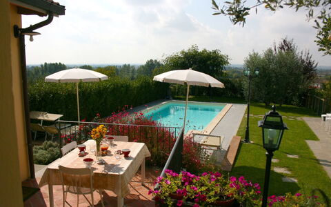 Casina Paradiso: Table, Plant, Cloud, Furniture, Sky, Flower, Umbrella, Chair, Shade, Outdoor Furniture