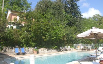 Villa La Quercia: Water, Plant, Sky, Building, Cloud, Azure, Swimming Pool, Tree, Outdoor Furniture, Shade