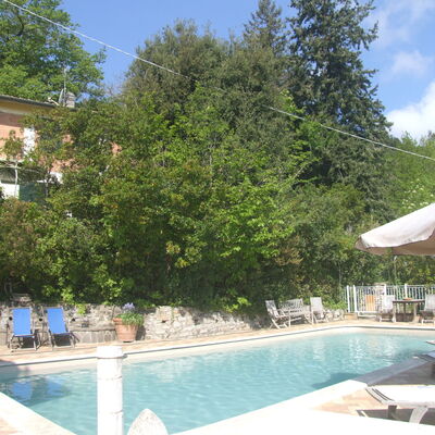Villa La Quercia: Water, Plant, Sky, Building, Cloud, Azure, Swimming Pool, Tree, Outdoor Furniture, Shade
